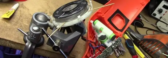 Vacuum cleaner repair parts and tools on a workbench in Peoria, IL